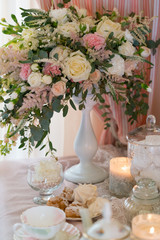 table decorated with fresh flowers and served for tea drinking