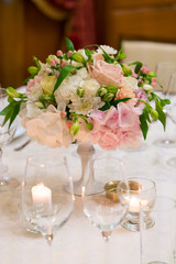 tables served and decorated with flowers for a wedding dinner