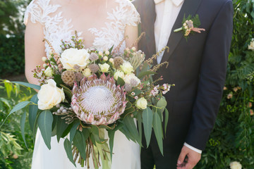 magnificent rustic bouquet of protea and other flowers and herbs