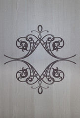 ornamental patterned pattern on a white wooden surface