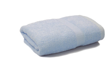 Fototapeta na wymiar light blue towel folded isolated on white background