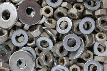 background texture set of galvanized hexagonal nuts and rings of different sizes and types