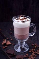 Layered dessert in an Irish glass mug with coffee and chocolate