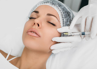 botulinum toxin injection into face, for lifting skin . Face injection top view