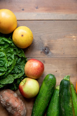 Obraz na płótnie Canvas Fresh Fruit and vegetables on wood