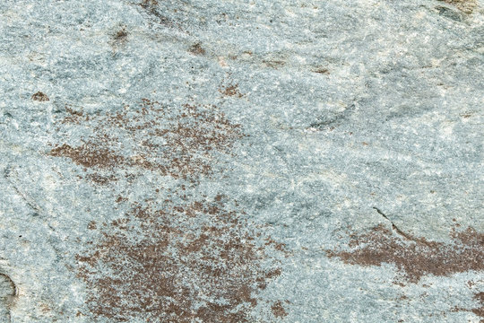 Gray stone texture with white spots.