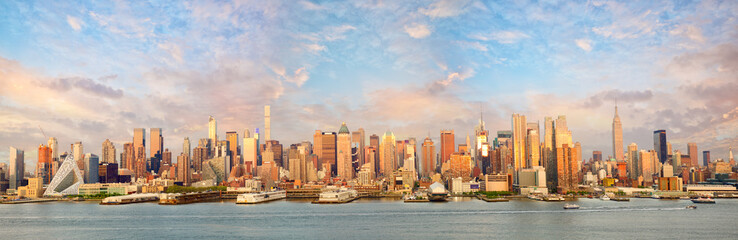 New York City Manhattan skyline panorama at sunset over Hudson River