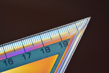 Obraz premium Ruler with cross polarization effect, isolated on a black background