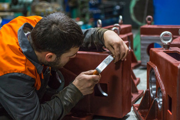 An employee of a machine-building enterprise kern for drilling.