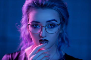 Sexy woman in glasses with vamp makeup