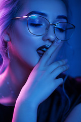 Sexy woman in glasses with vamp makeup