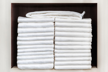 Stack of adult diapers on the shelf. Health care for elderly and bedridden people with urinary...
