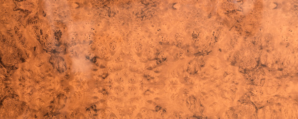 brown lacquered polished wooden surface