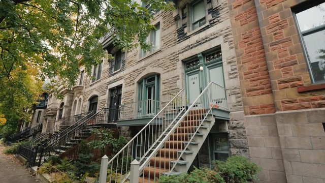The facade of an old Victorian house on one of the cozy streets of Montreal
