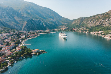 Fototapeta na wymiar summer time. aerial view of sea bay with boats and cruise liner