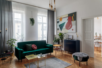 Luxury and modern home interior with design furniture, coffee tables, pouf, lamps and accessories....