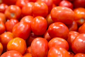 Close up group of fresh red tomatoes of organic vegetables at fresh market