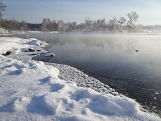 River in winter and swirling fog