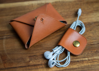 tan wallet and cable organizer 