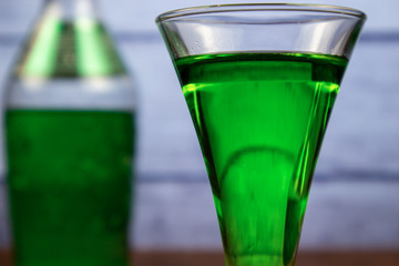 Green banana liqueur in a glass
