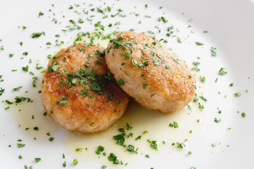 fried Pozharsky chicken cutlets with butter and parsley