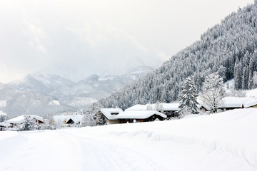 Fototapeta na wymiar The winter ski chalet and cabin in snow mountain landscape in Austria, Europe.