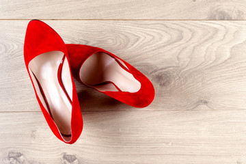 Red female shoes on high heels. Minimal fashion concept