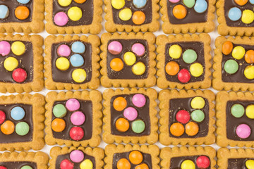 biscuits decorated with colored chocolate candy