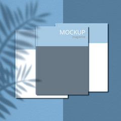 Mockup magazine against light blue background with shadow of branches. Cover page. Blank copy space for your promotional content