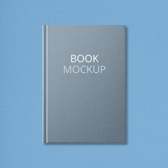 Isolated shot of grey mock up book with empty space on hardcover for your advertising content or image. Literature