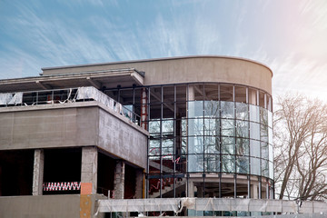 Fototapeta premium Aluminium glazed walls. Construction of modern building with metal glass windows. installation of a glass facade. Panoramic glazing. Restoration and renovation of building. Rebuild concept