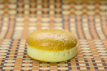 Hamburger bun in different positions on a beautiful background.