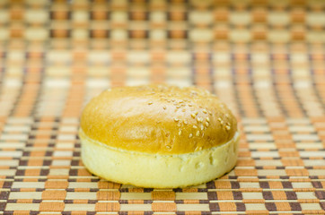 Hamburger bun in different positions on a beautiful background.