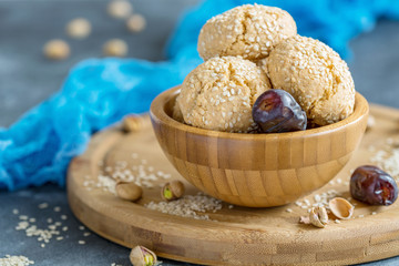 Homemade Moroccan sesame cookies in a wooden bowl.