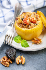 Baked apple with cottage cheese, fruit and nuts.