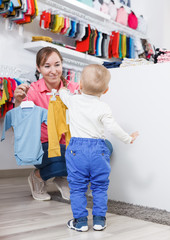  mom with kid is looking clothes