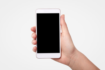 Unrecognizable woman holds smart phone with blank screen for your promotional content or advertisement, isolated over white background. Technology concept. Modern electronic device, mock up.