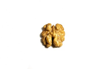 Half walnut isolated on white background. Top view, closeup