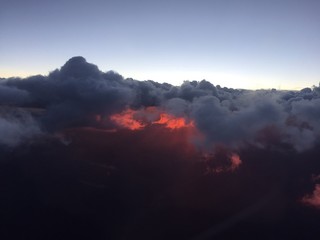 Naklejka premium Sunset behind cloudy sky