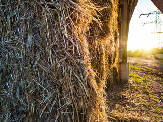 Haystack under the dome in the sunlight of the sunset.