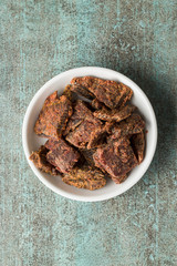 Beef jerky pieces.