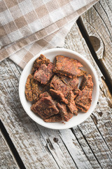 Beef jerky pieces.