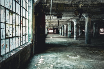 Interior view of the abandoned Fisher Body Plant factory in Detroit. The plant is abandoned and vacant ever since.