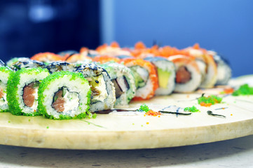 Sushi set: sushi roll with salmon and sushi roll with smoked eel, selective focus.