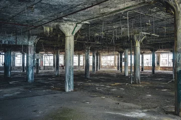 Fototapeten Verlassene Gebäude Interior view of the abandoned Fisher Body Plant factory in Detroit. The plant is abandoned and vacant ever since.  © Mathias