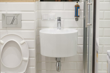 Combined contemporary white bathroom with toilete.