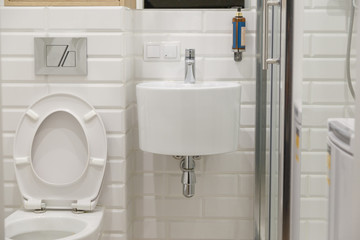 Combined contemporary white bathroom with toilete.