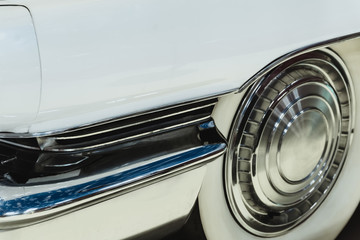 background - fragment of  white vintage car hood with wheel and fender