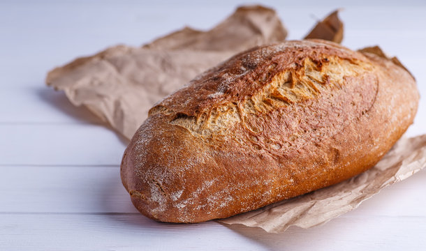 Freshly Baked Homemade Bread, close-up, isolated on a white background.