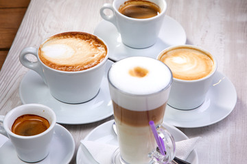 set of coffee drinks on the white wooden background